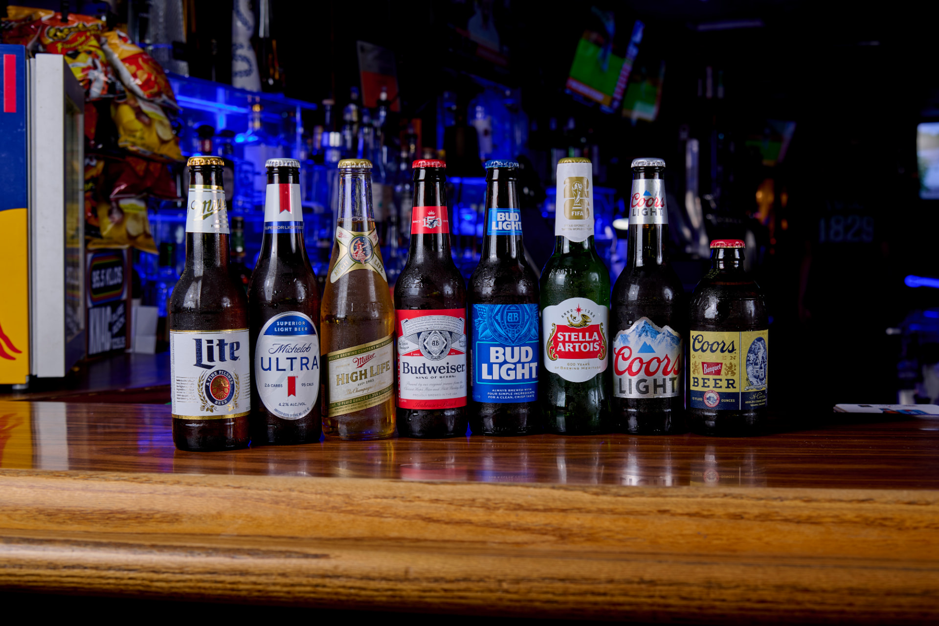 Lineup of cold bottled beers on the bar at Harvey's